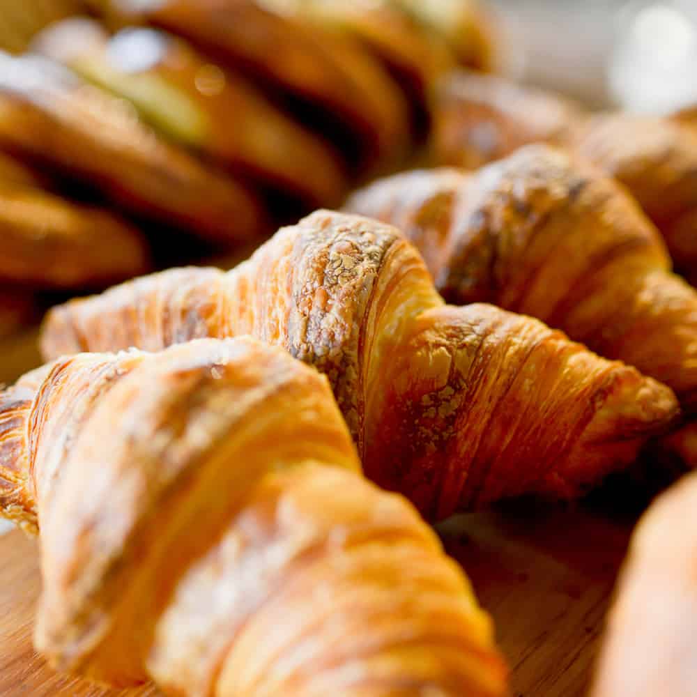 Croissants on a wooden board Bellbird Bakery Tannery