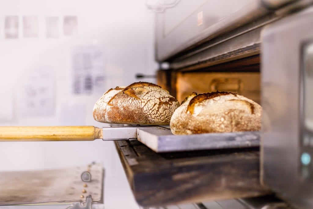 Loaves coming out of the oven Sourdough workshop baking class