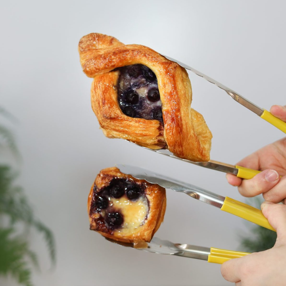 Mini Fruit Danish and regular Fruit Danish held side by side
