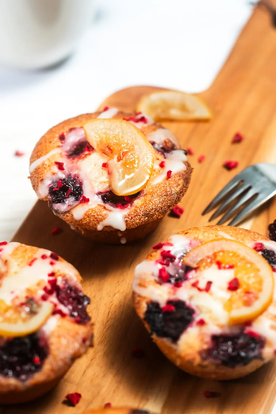 Lemon and Berry Friand on Wood board, with ingredients
