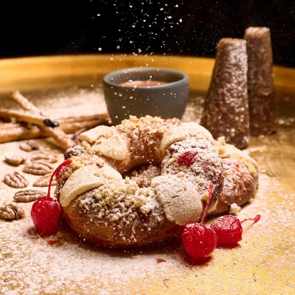 Rosca de Reyes Mexican cake with preserved cherries and icing sugar