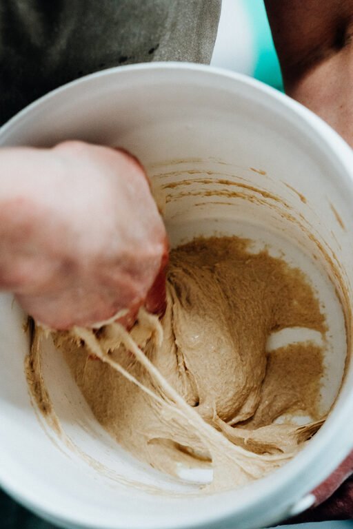 Mixing sourdough starter by hand