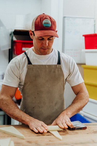 Jeremy MacCormack rolling croissants at Bellbird Bakery, Christchurch