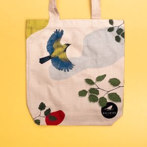 Closeup of Bellbird Bakery Tote Bag on Yellow Background