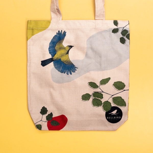 Closeup of Bellbird Bakery Tote Bag on Yellow Background