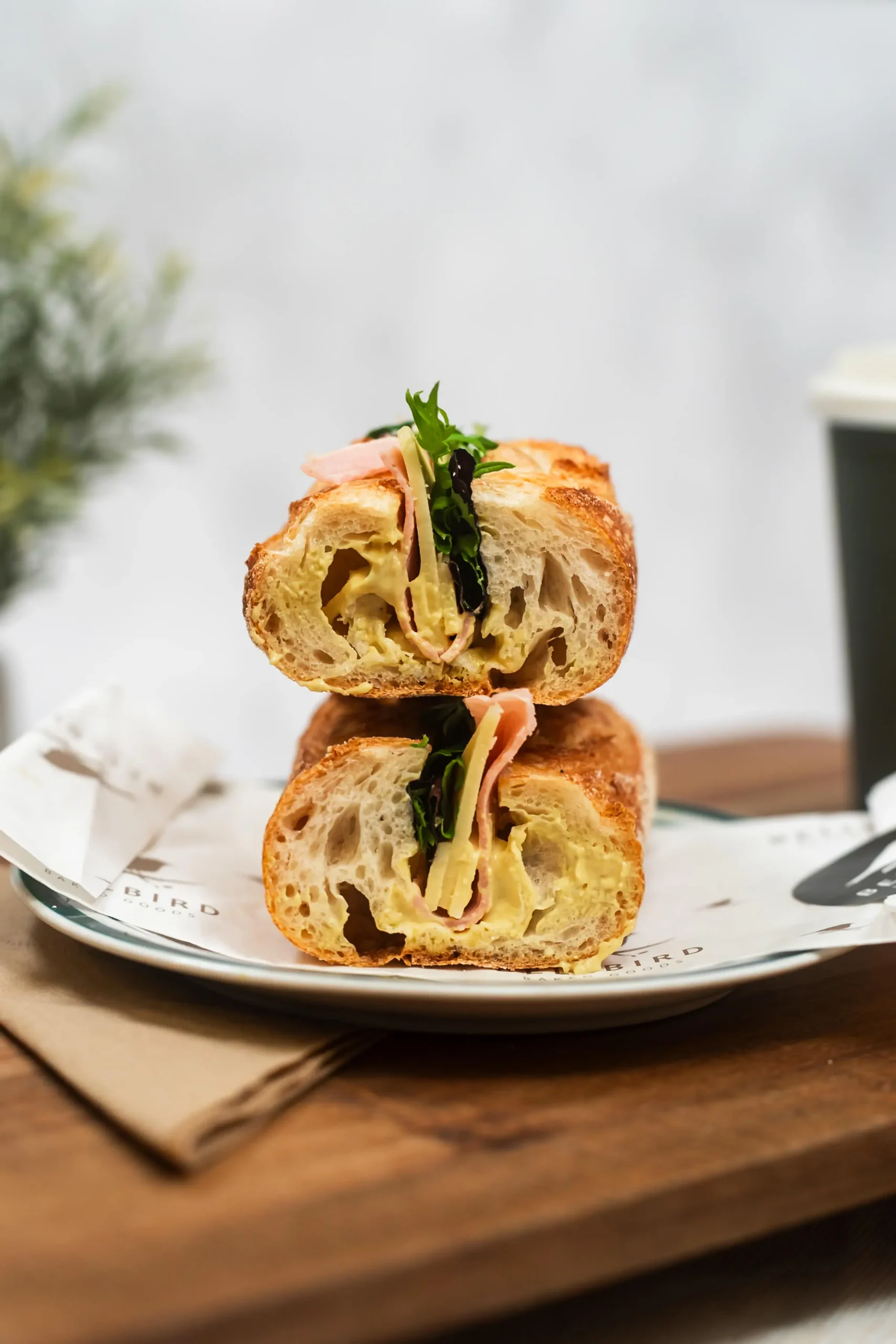 Ham & Cheese Baguette cut in half on the Board