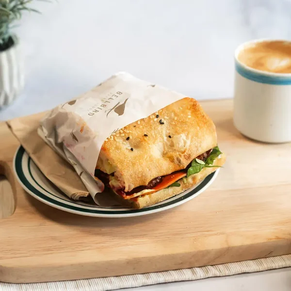 Tempeh Sandwich on Wood Board with Coffee
