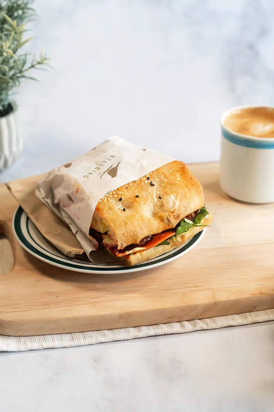 Tempeh Sandwich on Wood Board with Coffee