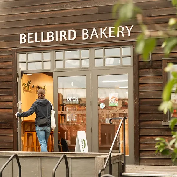 Customer walking into Bellbird Bakery Entrance at the Tannery