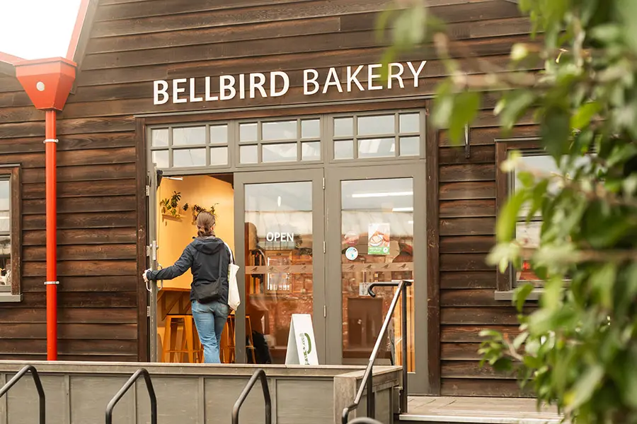 Customer walking into Bellbird Bakery Entrance at the Tannery