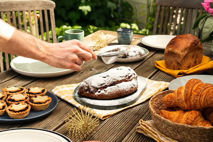 Fruit Stollen get icing sugar put on