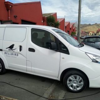 Electric delivery van parked outside Bellbird Baked Goods