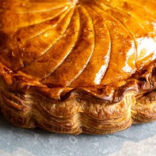Galette des rois close up side on light backdrop