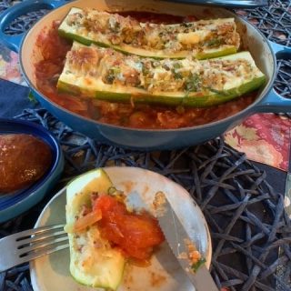 Stuffed marrow with sourdough and tomato sauce on a plate Bellbird Bakery recipe