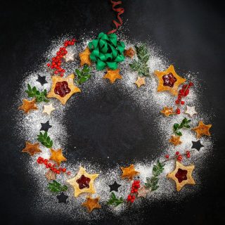 Top View of Christmas Cookies on black board